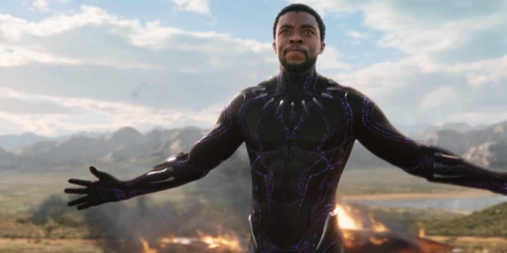 T'Challa, played by Chadwick Boseman holds his arms out while in the Black Panther suit in 'Black Panther'.