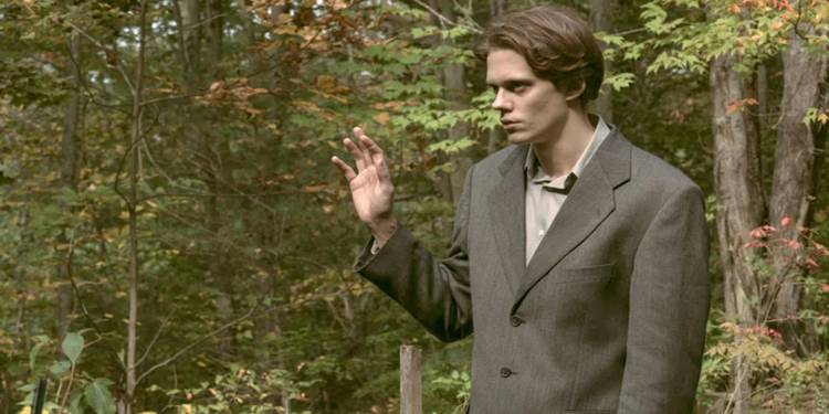 Bill Skarsgard as The Kid wearing an ill-fitting suit in the woods in Season 1 of Castle Rock.