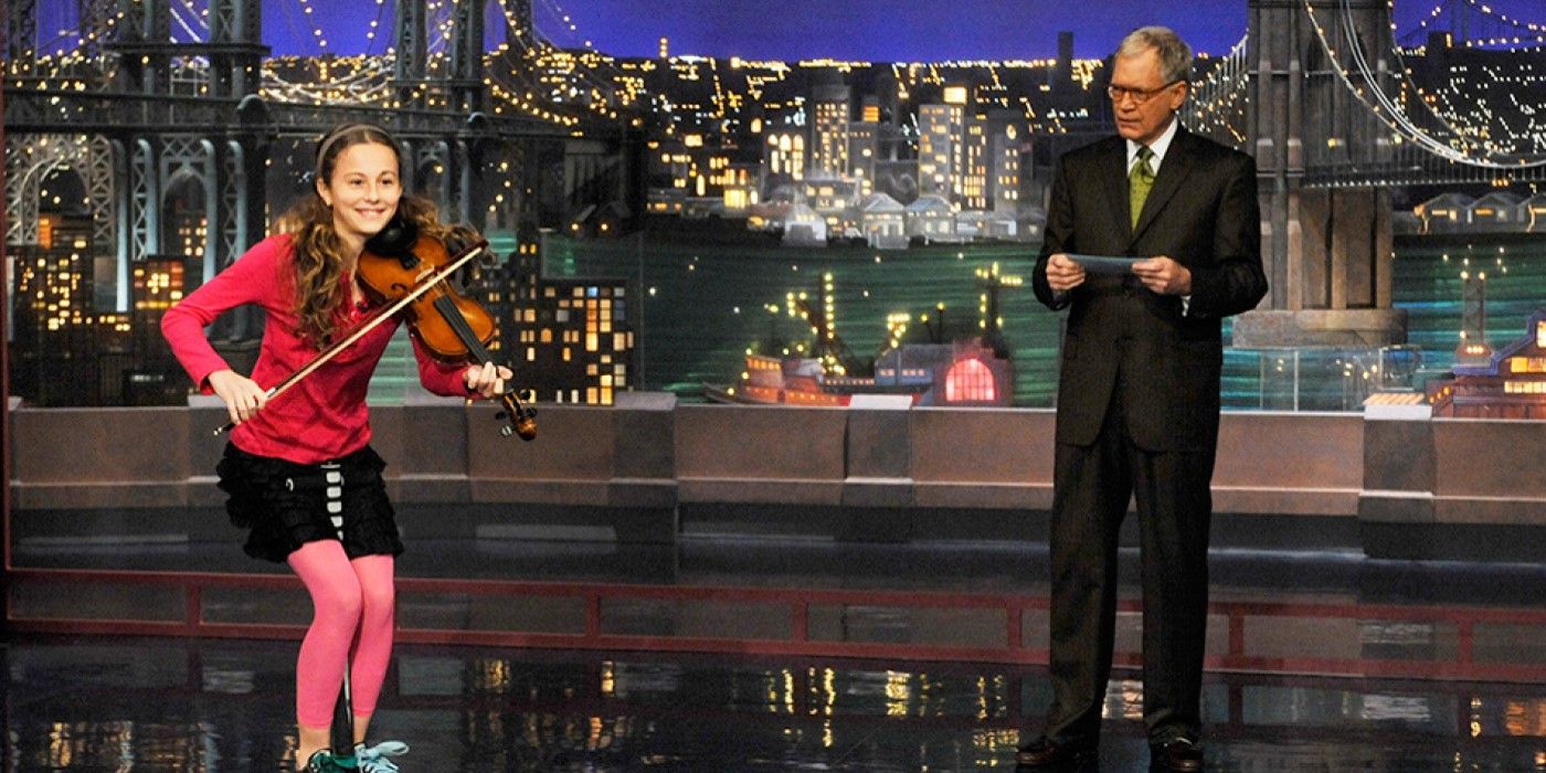 David Letterman introduces a girl playing violin on "Stupid Human Tricks" on Late Show with David Letterman