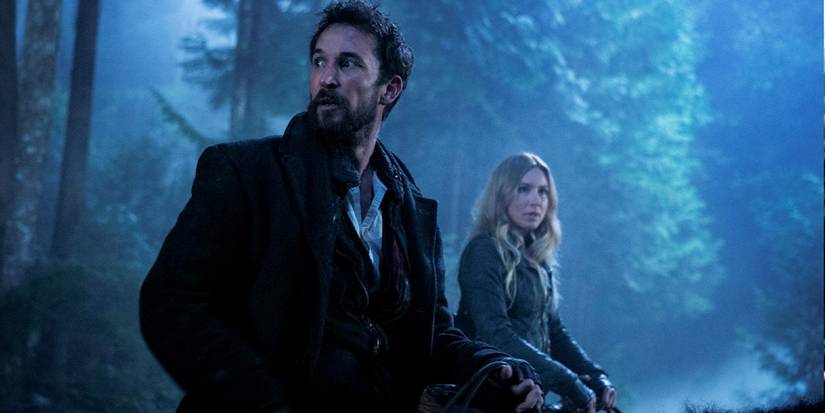 Tom Mason (Noah Wyle) and Maggie May (Sarah Carter) wander the woods on 'Falling Skies'