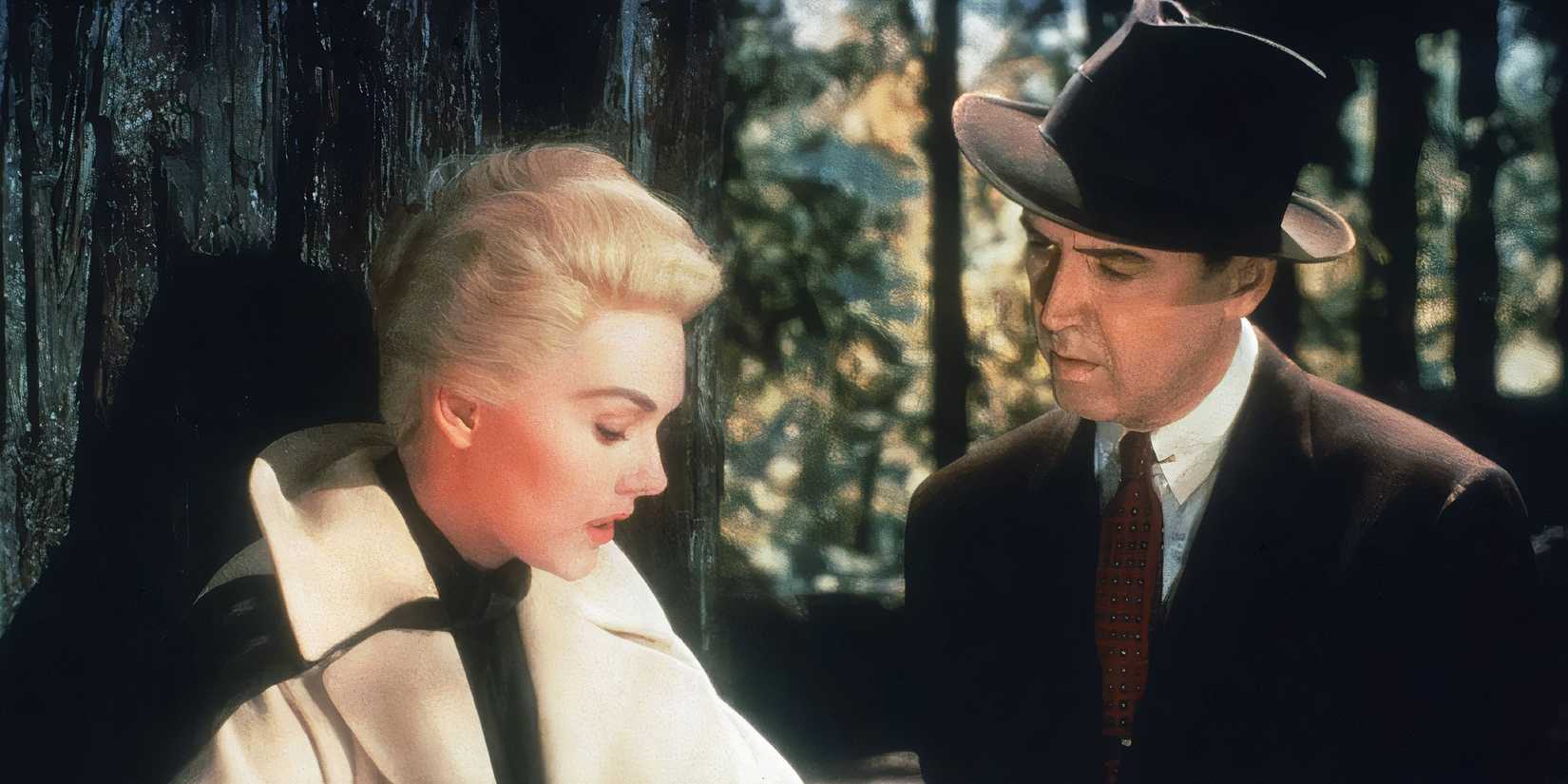 Kim Novak and James Stewart as Madeline and John standing in the woods in Vertigo