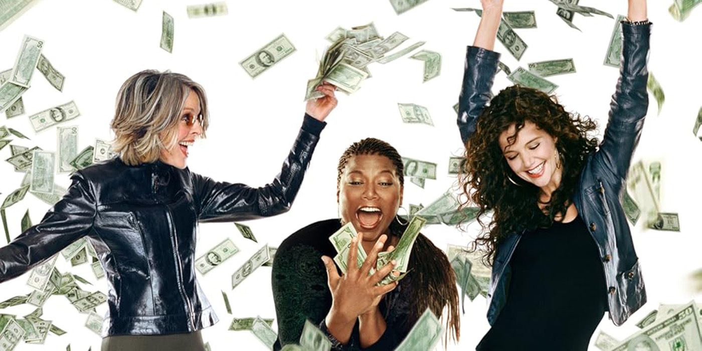 Three women celebrating with dollar bills falling from the sky