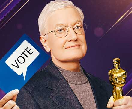 Film critic Roger Ebert holding an Academy Award and holding a card that says Vote.
