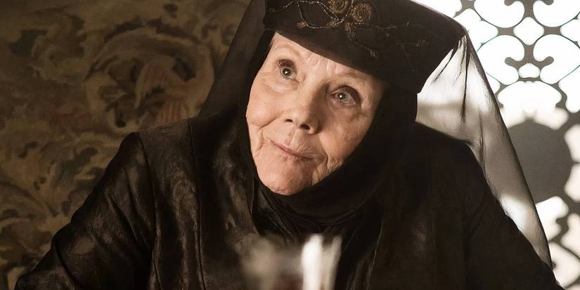Olenna Tyrellin in The Game of Thrones series smiling smugly.