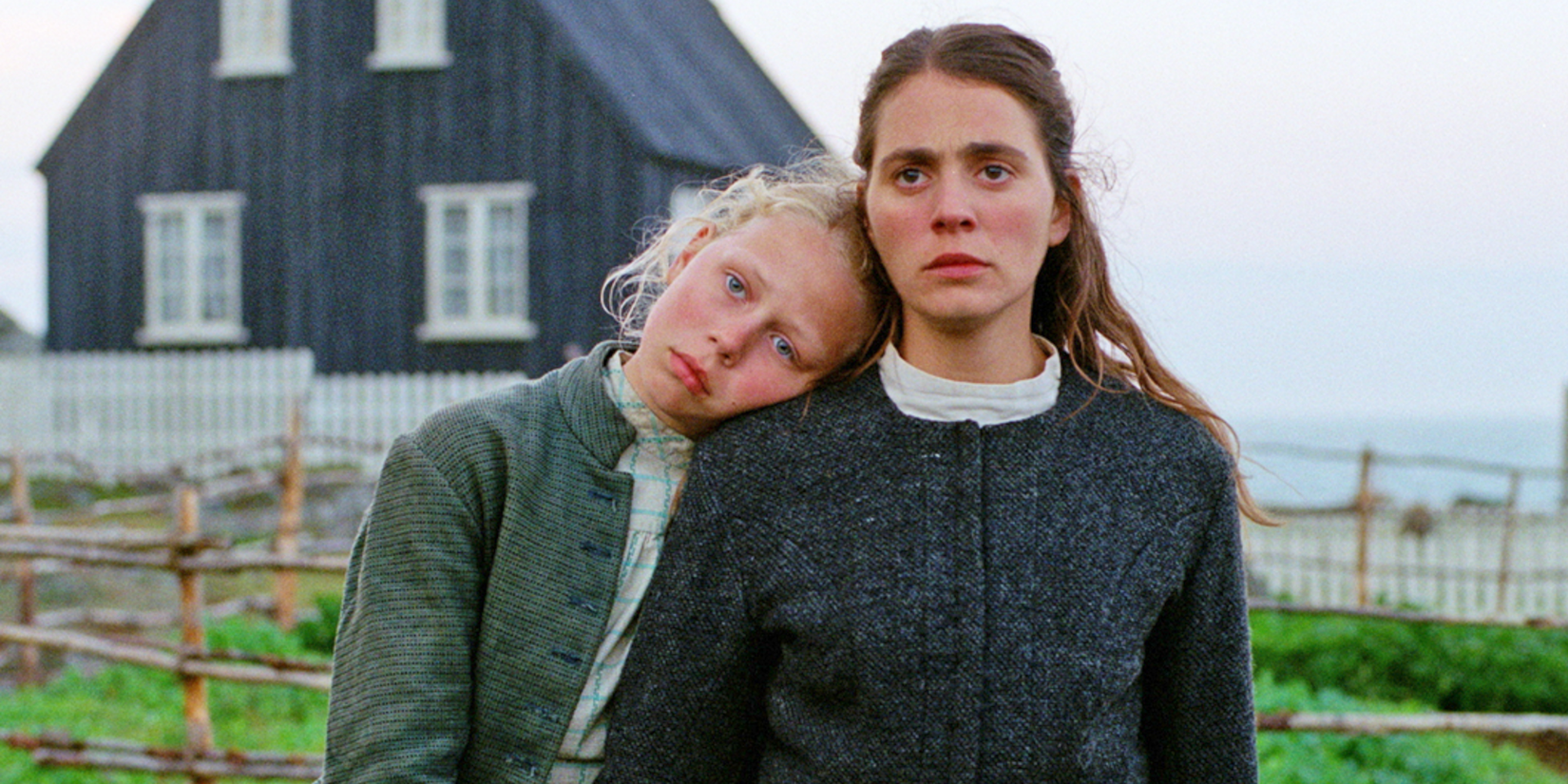 Two young girls looking ahead in godland