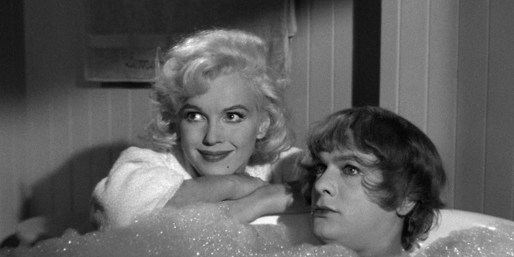 Marilyn Monroe next to Tony Curtis, who is in drag inside a tub, in Some Like It Hot