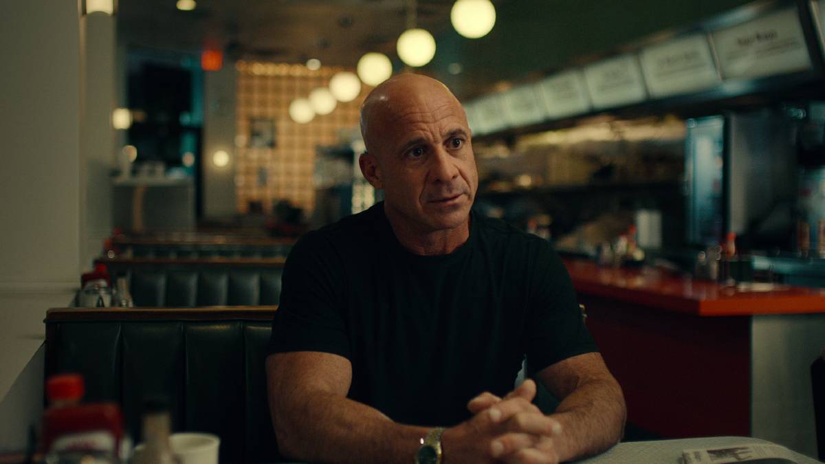 A survivor of The Battle of Mogadishu sits in a diner in Surviving Black Hawk Down