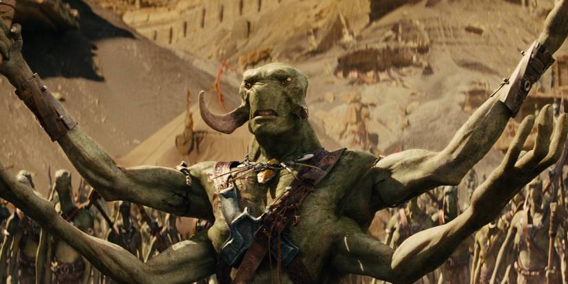 Tars Tarkis with his arms open wide in front of an army in John Carter