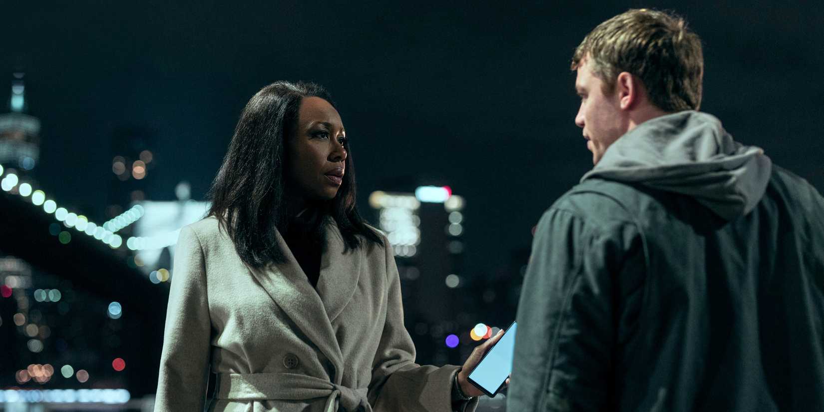 Gabriel Basso as Peter Sutherland talking to Amanda Warren as Catherine in Season 2 of The Night Agent