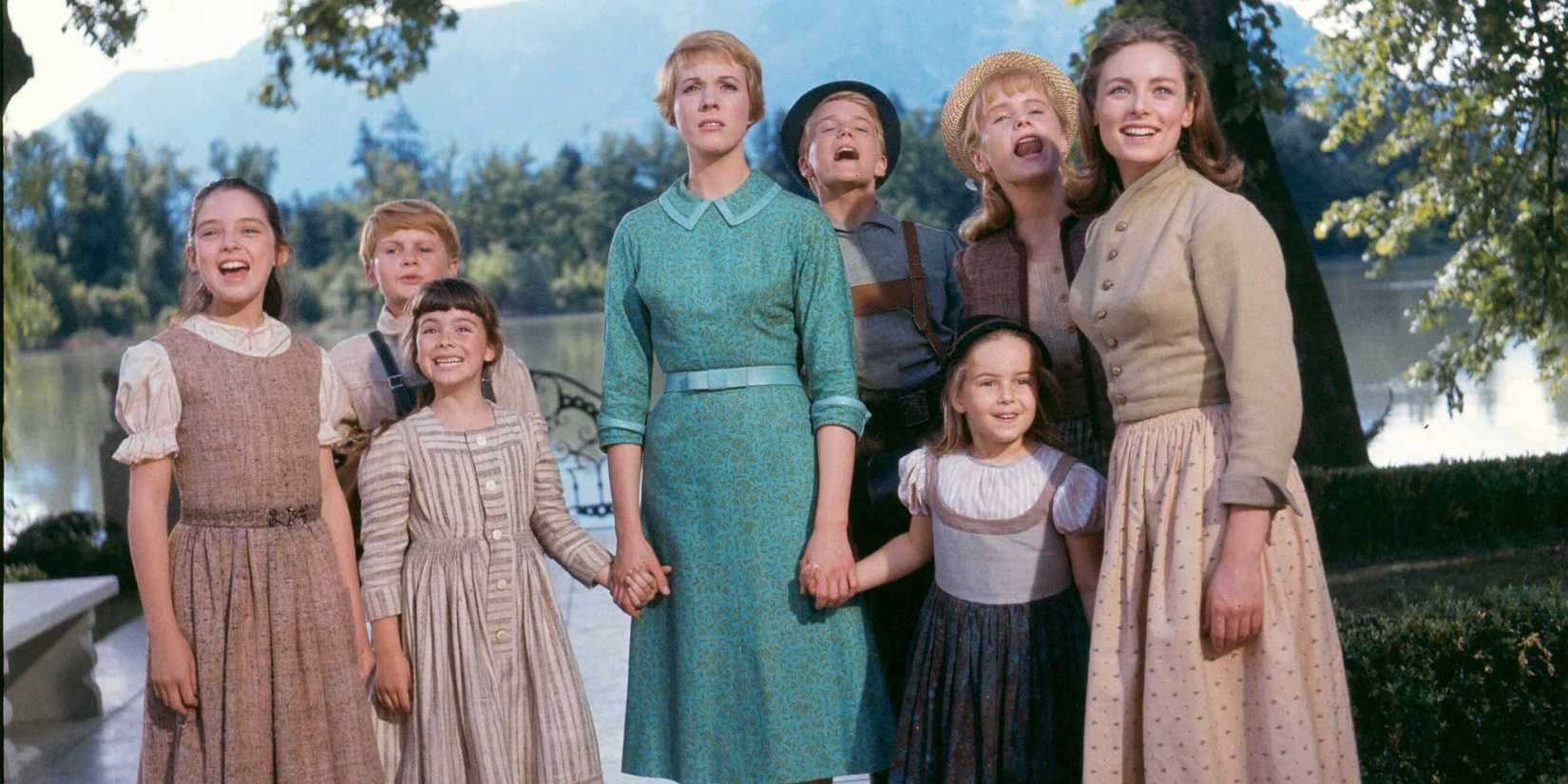 Maria and the Von Trapp children looking ahead in The Sound of Music.