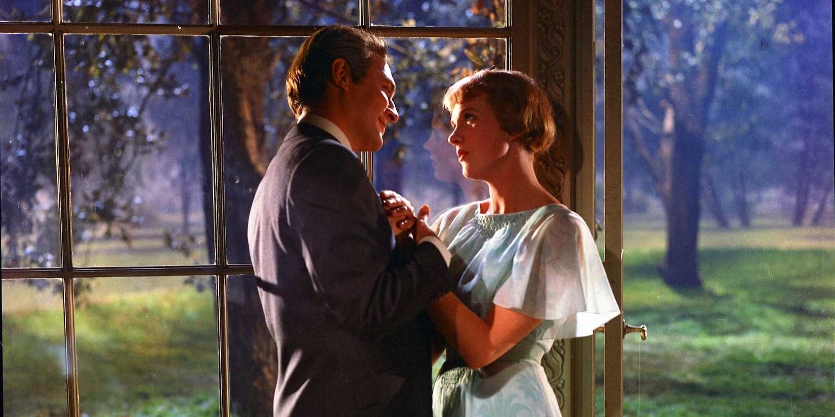 Christopher Plummer and Julie Andrews look lovingly at each other in a gazebo in The Sound of Music.