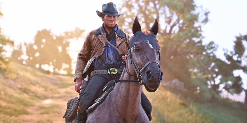 Arthur Morgan riding a horse in Red Dead Redemption 2