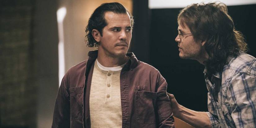 David Koresh (Taylor Kitsch) grabs Jacob Vazuqez (John Leguizamo) by the arm in 'Waco'