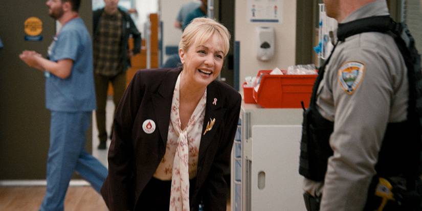 Wendi McLendon Covey smiling in St. Denis Medical Season 1, Episode 7.