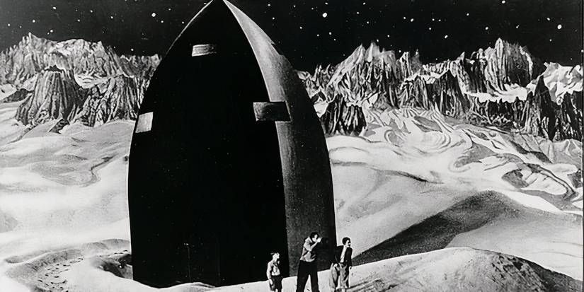 Three men next to a rocket on the moon in Woman in the Moon