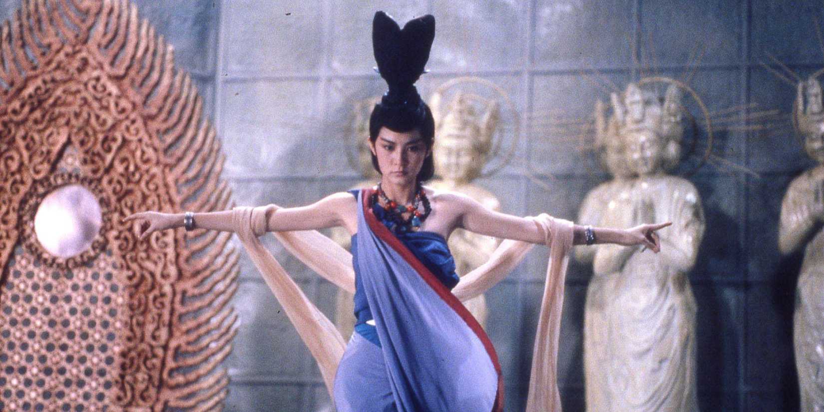 A woman spreading her arms in Zu_ Warriors from the Magic Mountain