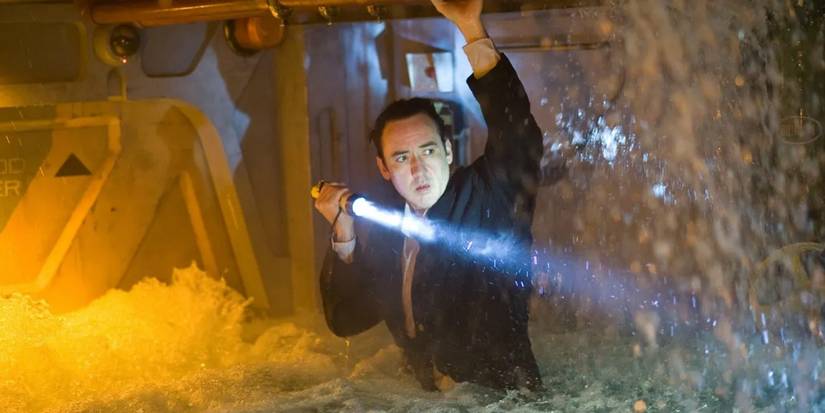 Jackson Davis (John Cusack) shines a flashlight in a flooded corridor in '2012'.