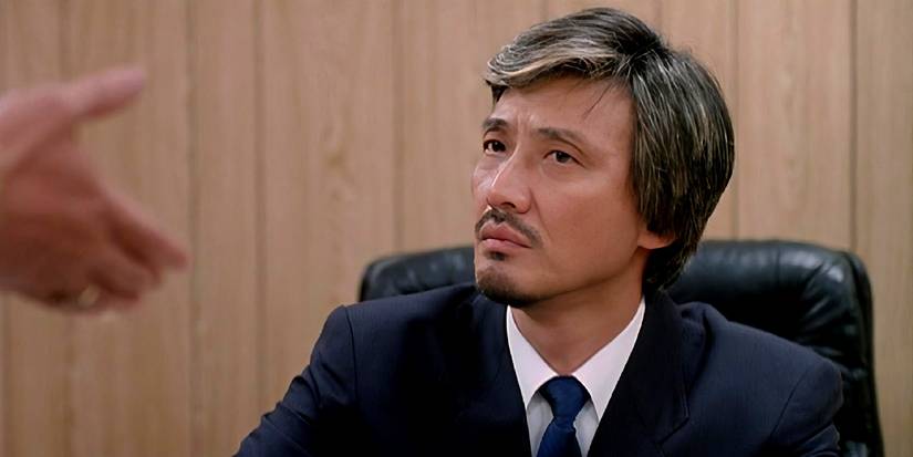 Dean Shek looking at an extended hand to shake in A Better Tomorrow II.