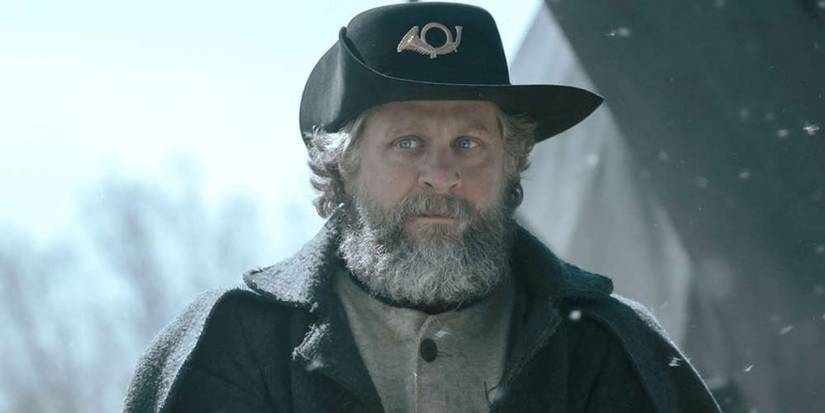 Joe Tippett looking serious as snow falls in American Primeval.