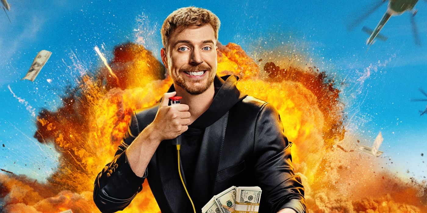 MrBeast smiling holding a detonator in one hand and cash in the other with an explosion in the background in a promo photo for 'Beast Games'