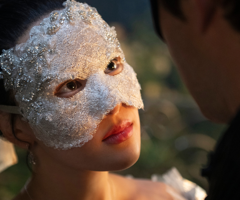 Bridgerton Season 4 Yerin Ha wearing a face mask looking up at a man
