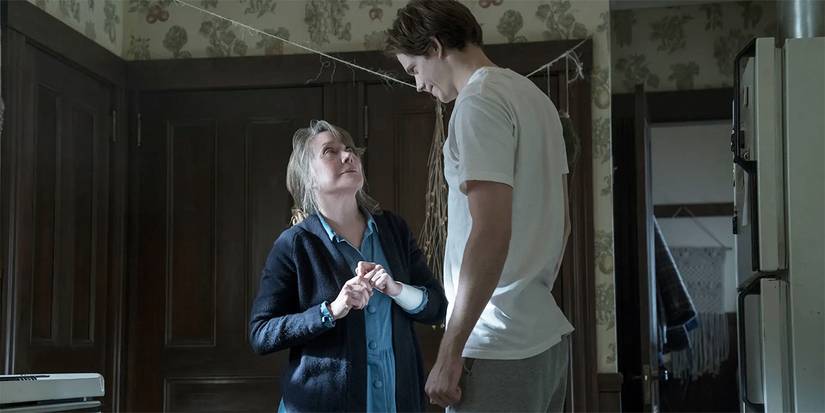 Bill Skarsgard staring down at Sissy Spacek in a kitchen in Castle Rock.