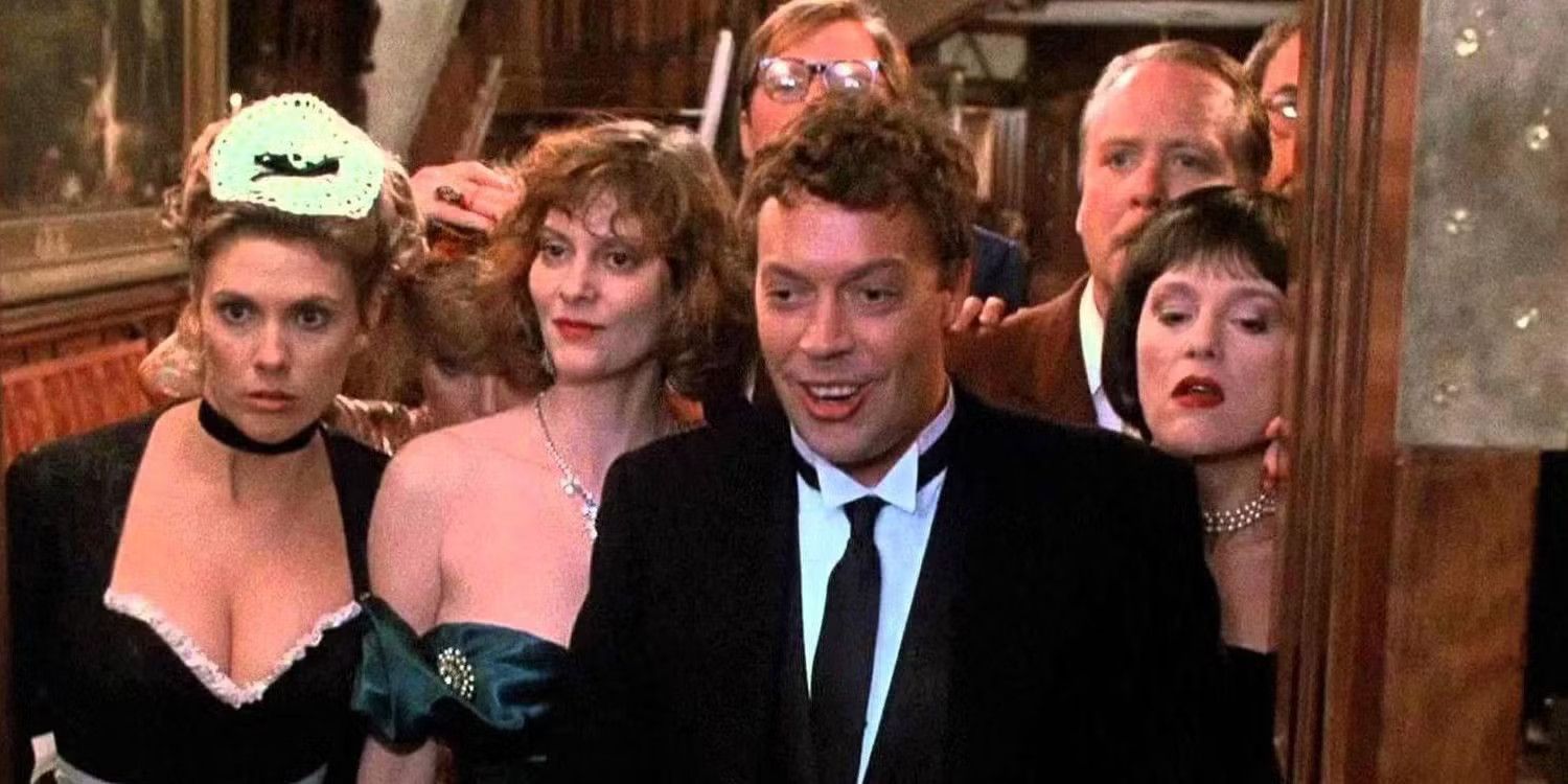 The cast of Clue crowd together looking at something off camera. 