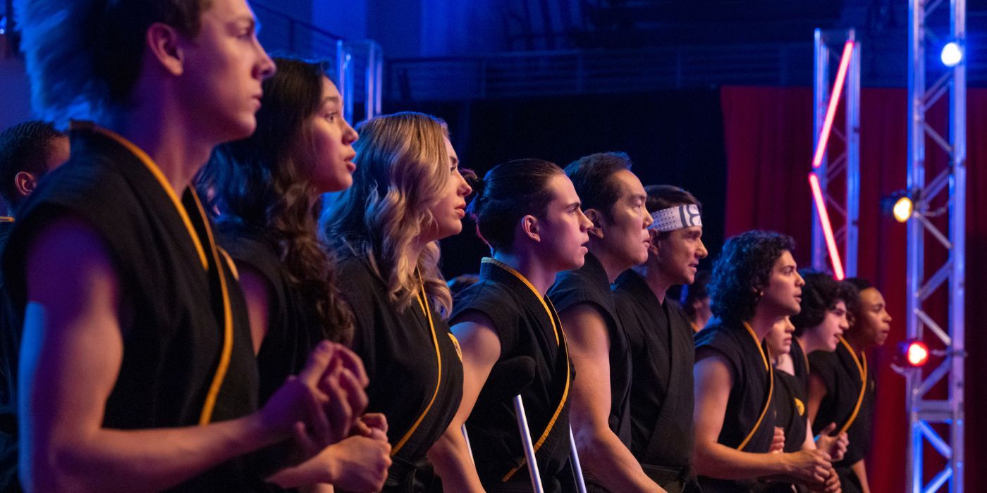 Jacob Bertrand (Hawk), Oona O&rsquo;Brien (Devon), Peyton List (Tory), Tanner Buchanan (Robby), Yuji Okumoto (Chozen), Ralph Macchio (Daniel), Xolo Mariduena (Miguel), Mary Mouser (Sam), Griffin Santopietro (Anthony), and Dallas Dupree Young (Kenny) lined up wearing Cobra Kai gis.