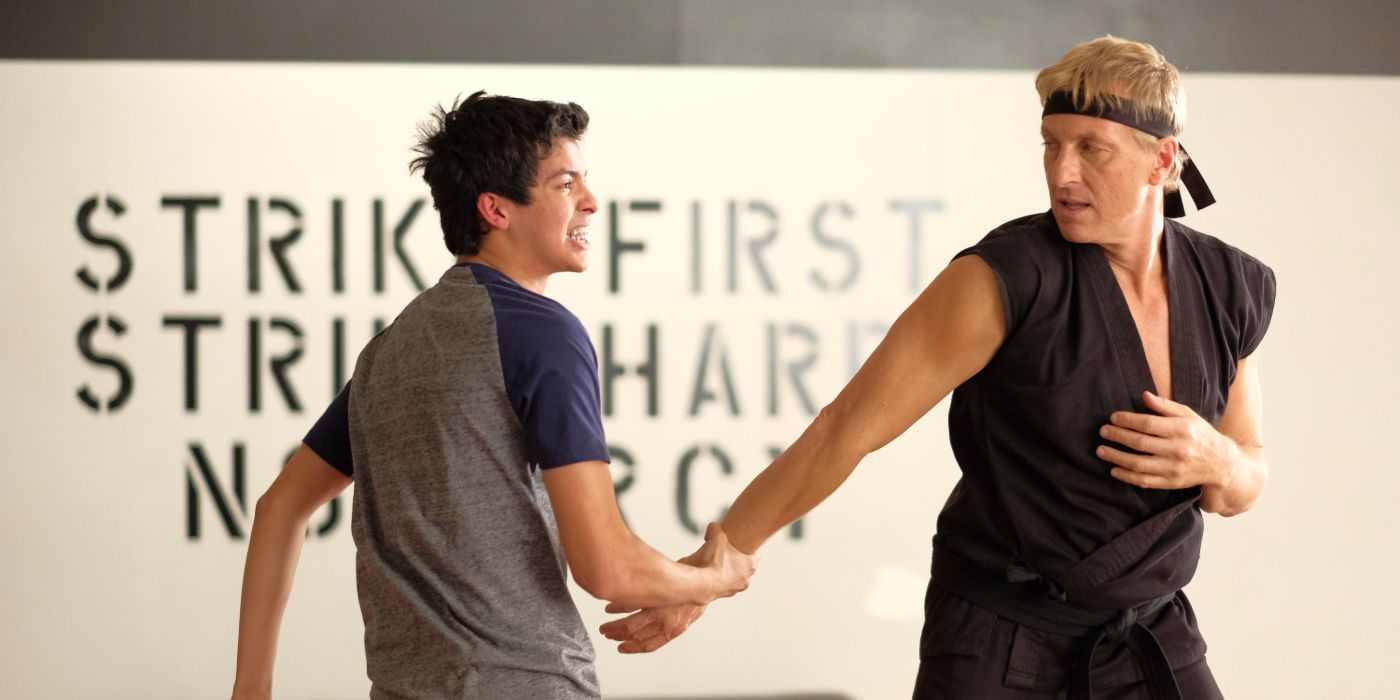William Zabka as Johnny fighting Xolo Mariduena as Miguel in Cobra Kai Season 1.
