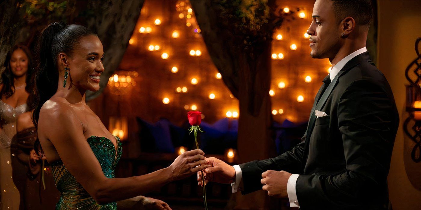 Grant handing Zoe a rose at a ceremony.