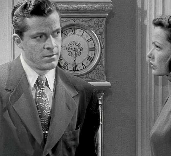 Dana Andrews and Gene Tierney looking at each other in Laura (1944).