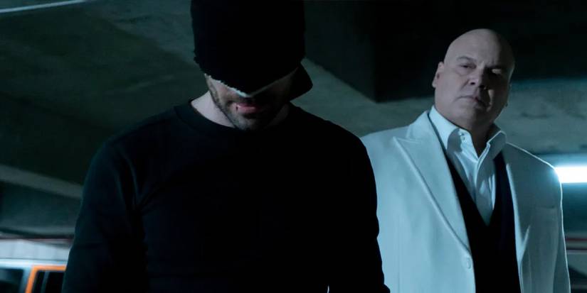 Daredevil (Charlie Cox) in his black outfit in a parking garage with Kingpin (Vincent D'Onofrio) behind him