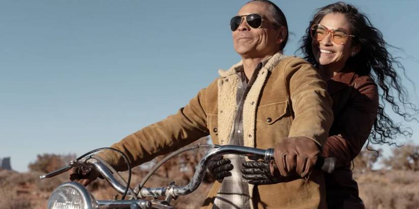 Joe Leaphorn (Zahn McClarnon) and Emma Leaphorn (Deanna Allison) on a motorcycle in 'Dark Winds'