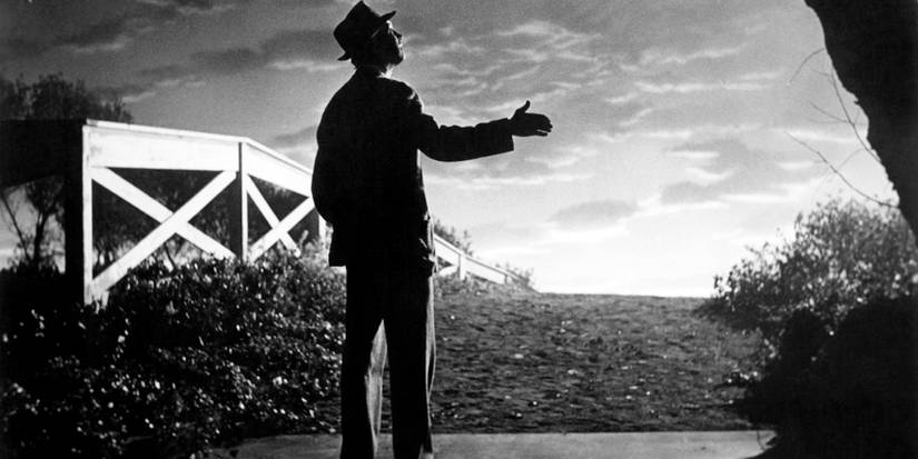 Elwood P. Down (Jimmy Stewart) walks into the sunset with Harvey by his side in 1950's Harvey.