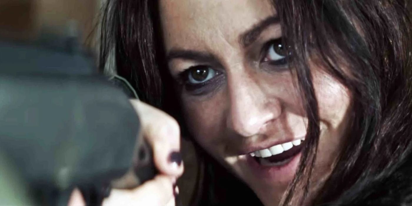 Comedy (Jamie Winston) aiming a shotgun with a toothy grin in Everyone Is Going to Die
