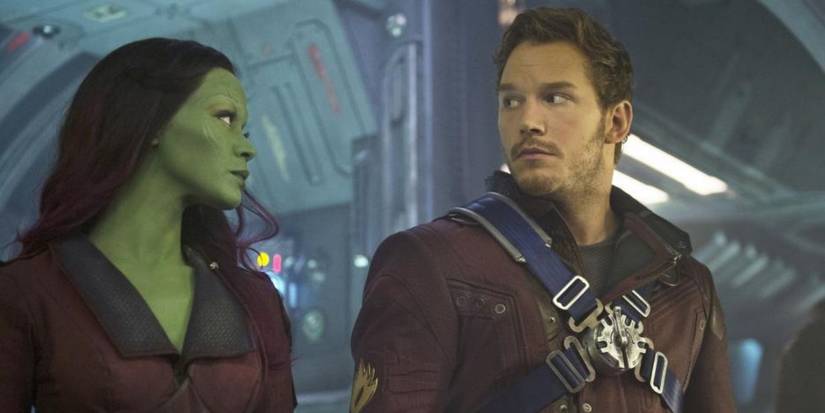 Gamora (Zoe Saldana) and Peter (Chris Pratt) side by side looking at each other in Guardians of the Galaxy.