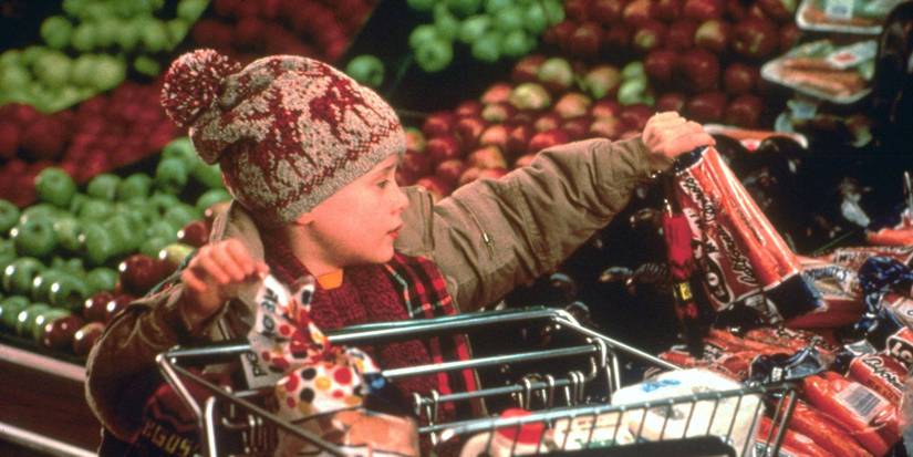 Macauley Culkin as Kevin on expensive grocery trip in Home Alone 1990.