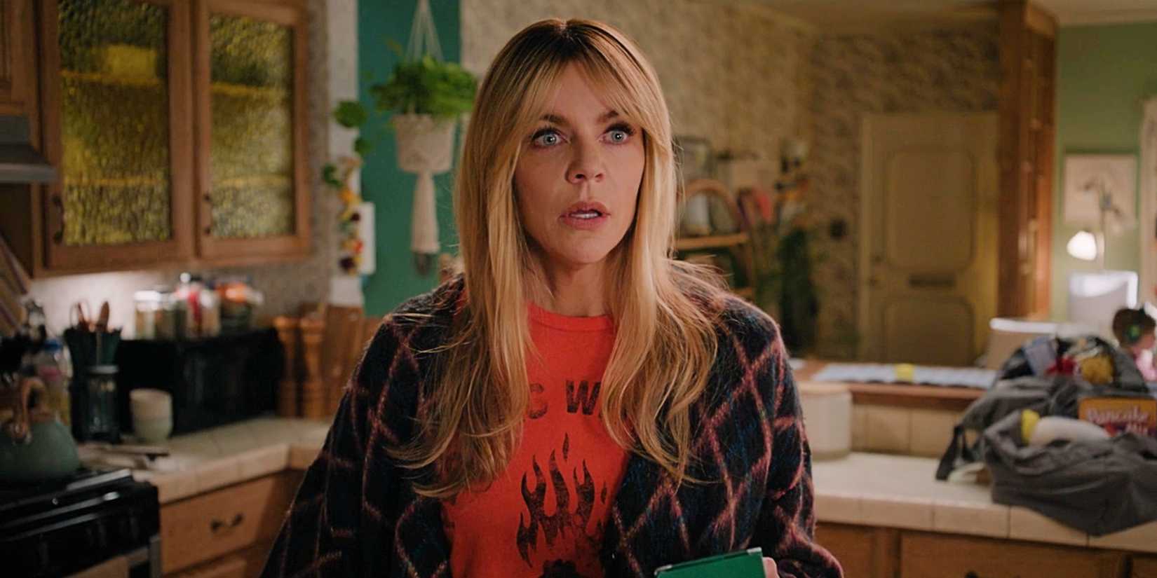 Kaitlin Olson as Morgan looking shocked and upset in her kitchen in the Season 1 finale of High Potential.