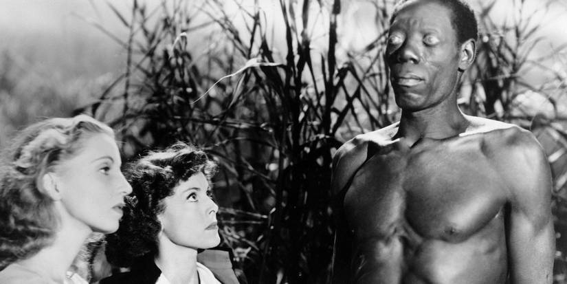 Frances Dee as Betsy Connell and James Ellison as Wesley Rand stare at Darby Jones as Carrefour in I Walked With a Zombie
