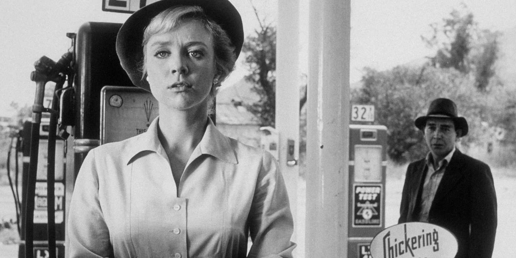 Inger Stevens stands by a gas pump with back towards Leonard Strong in The Twilight Zone's The Hitch-Hiker.