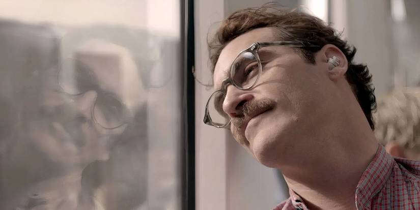 Joaquin Phoenix as Theodore Twombley staring out the window in 'Her' (2013).