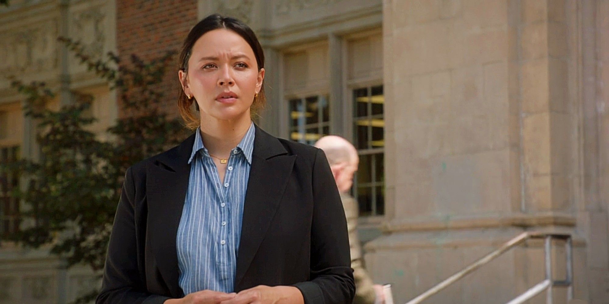 Lucy Chen looking concerned at Seth's high school in The Rookie Season 7 Episode 5