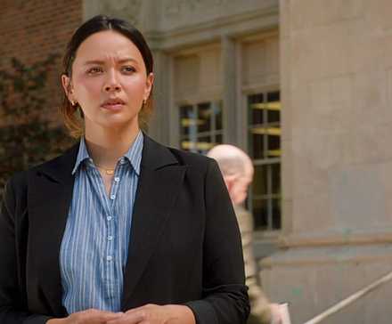 Lucy Chen looking concerned at Seth's high school in The Rookie Season 7 Episode 5