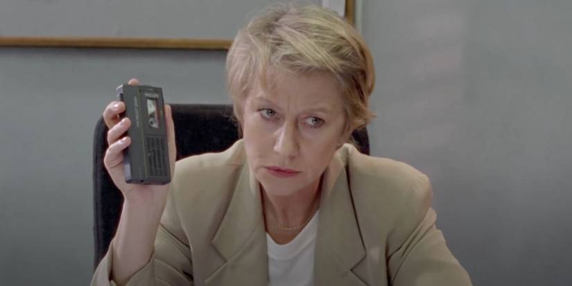 DCI Jane Tennison (Helen Mirren) holds a tape recorder in the crime show Prime Suspect.