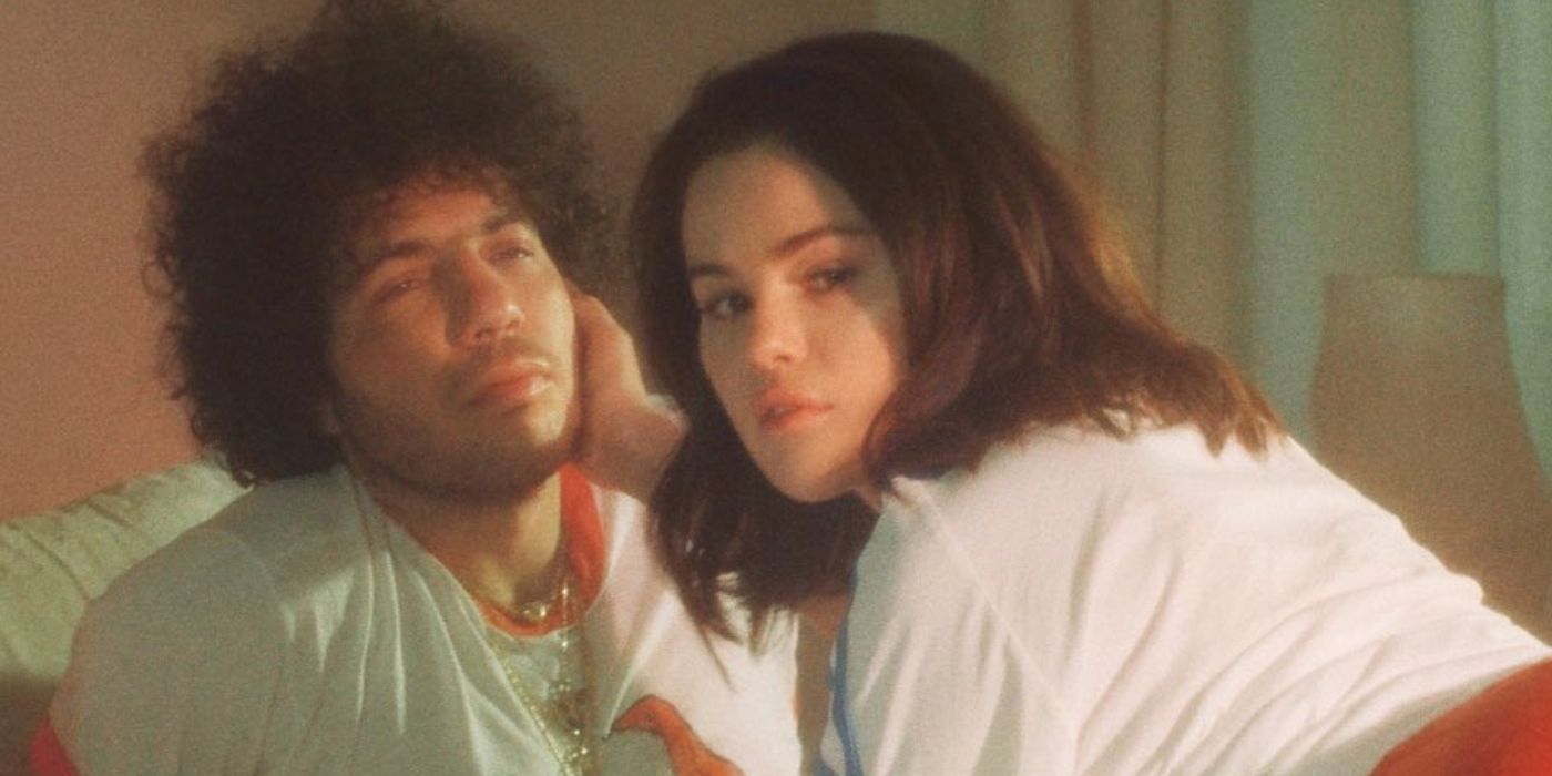 Selena Gomez holding Benny Blanco's face in art for their upcoming album, 'I Said I Love You First'.