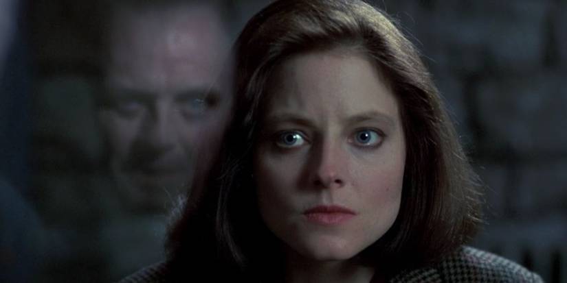 Hannibal Lecter is shown in reflection of his glass cell as Clarice Starling looks on in Silence of the Lambs