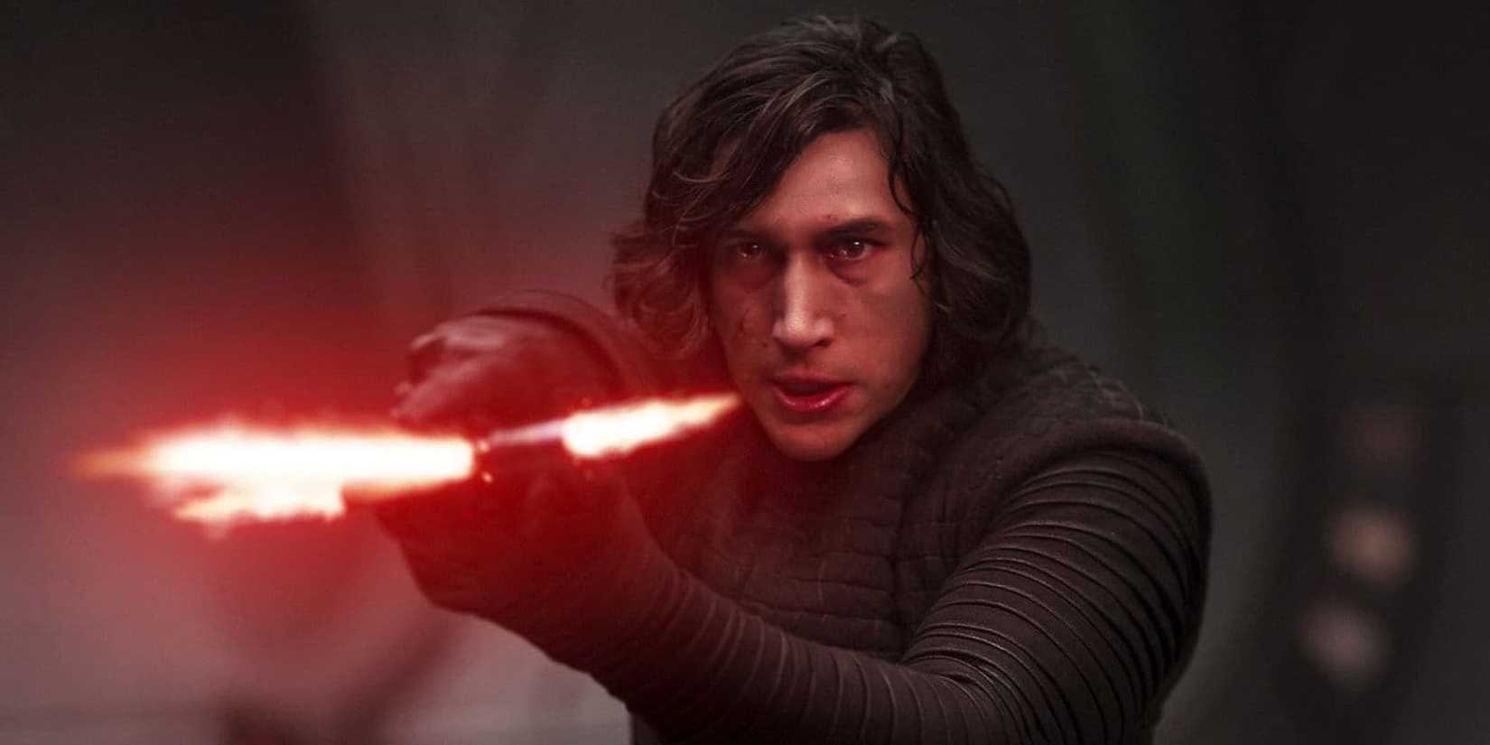 Kylo Ren aiming his lightsaber at someone off-camera in Star Wars: Episode VII- The Last Jedi