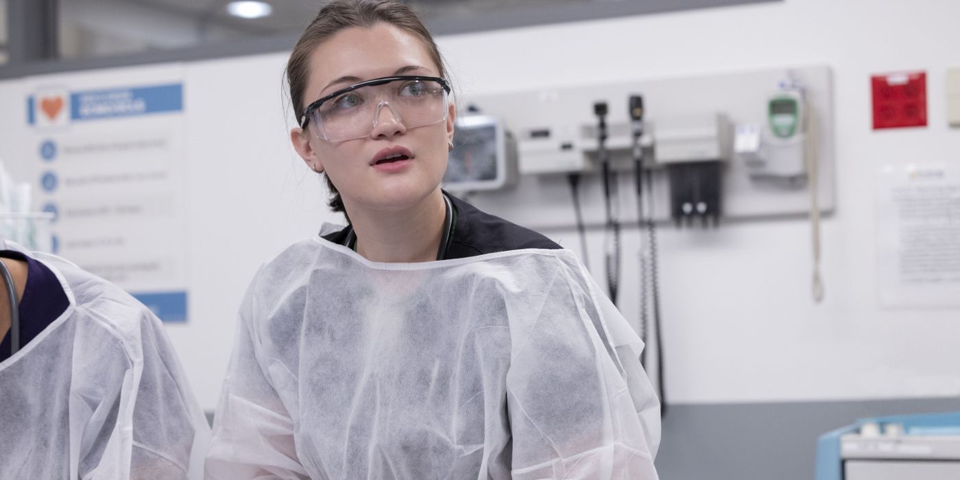 Dr. Santos (Isa Briones) stands in goggles and a white covering in a hospital room in &lsquo;The Pitt&rsquo;