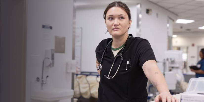 Dr. Trinity Santos (Isa Briones) stands in black scrubs with a stethoscope in 'The Pitt'.