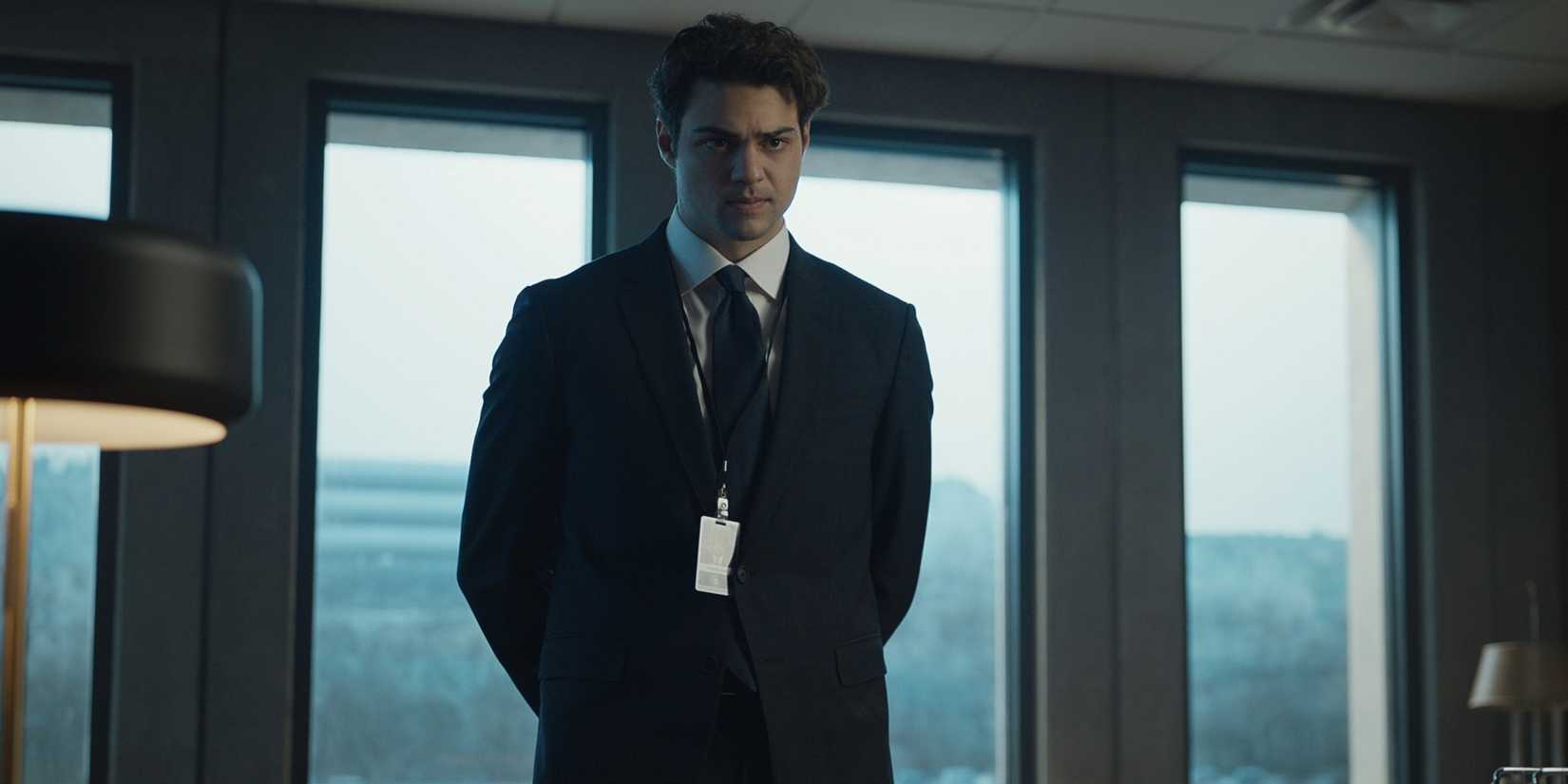 Noah Centineo as Owen Hendricks standing in an office during a CIA mission in Season 2 of The Recruit